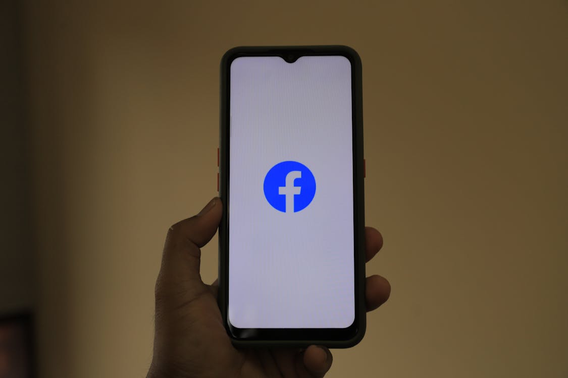 Smartphone showing the Facebook logo on its screen