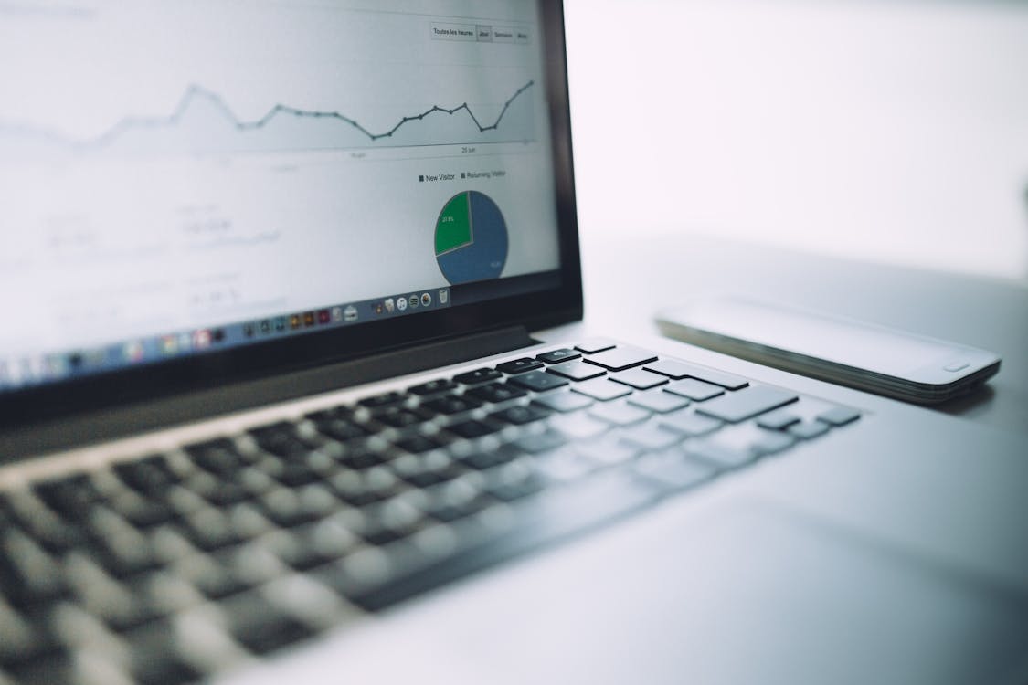 Laptop showing an analytics dashboard with charts and graphs for troubleshooting
