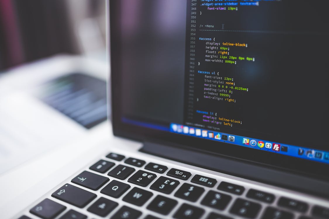 Developer working at a computer with design software