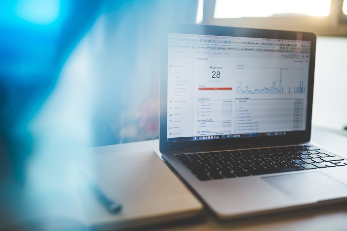 Laptop displaying Google Analytics dashboard for search marketing analysis