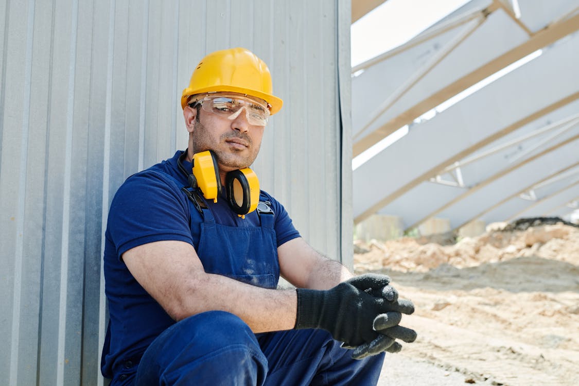 Construction worker wearing safety gear at a job site