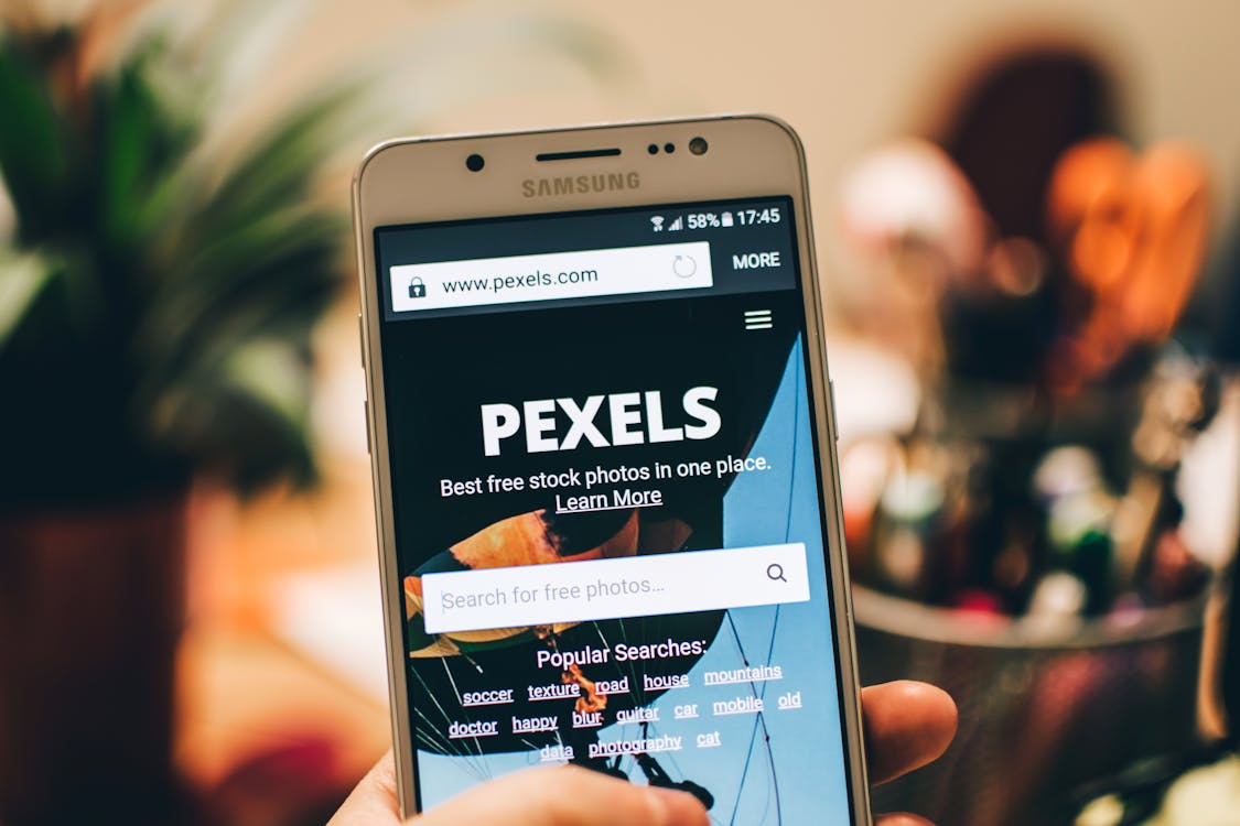 Person browsing a website on a mobile phone
