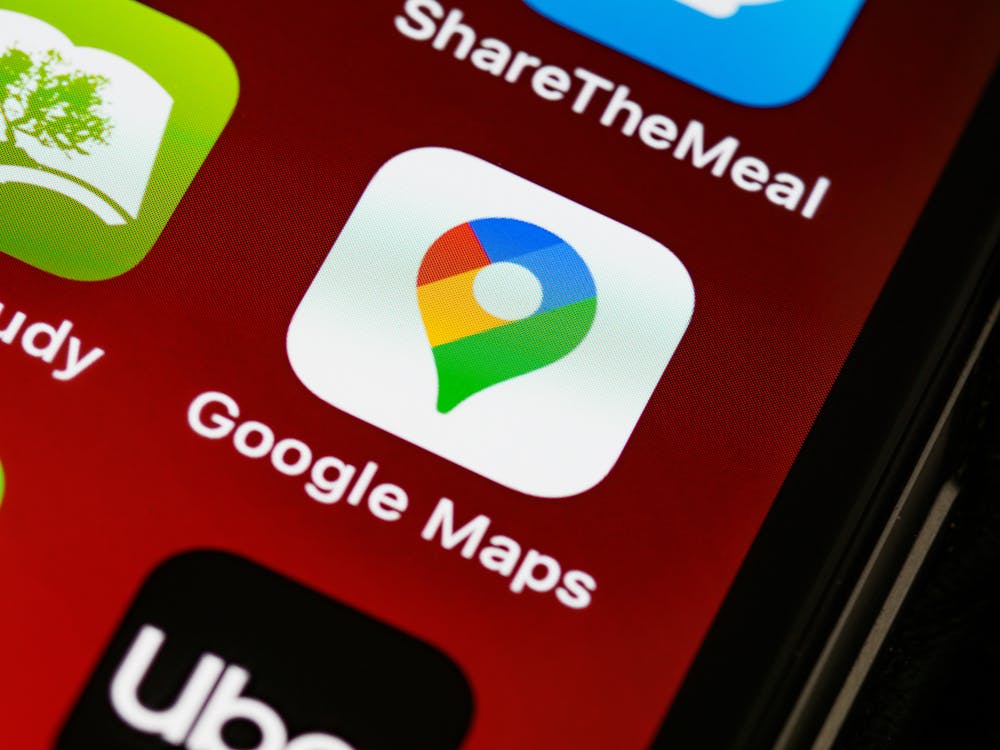 Google Maps app icon on a smartphone screen representing local search