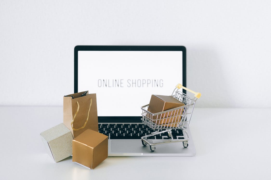 Laptop displaying an online shopping cart representing retargeting advertising